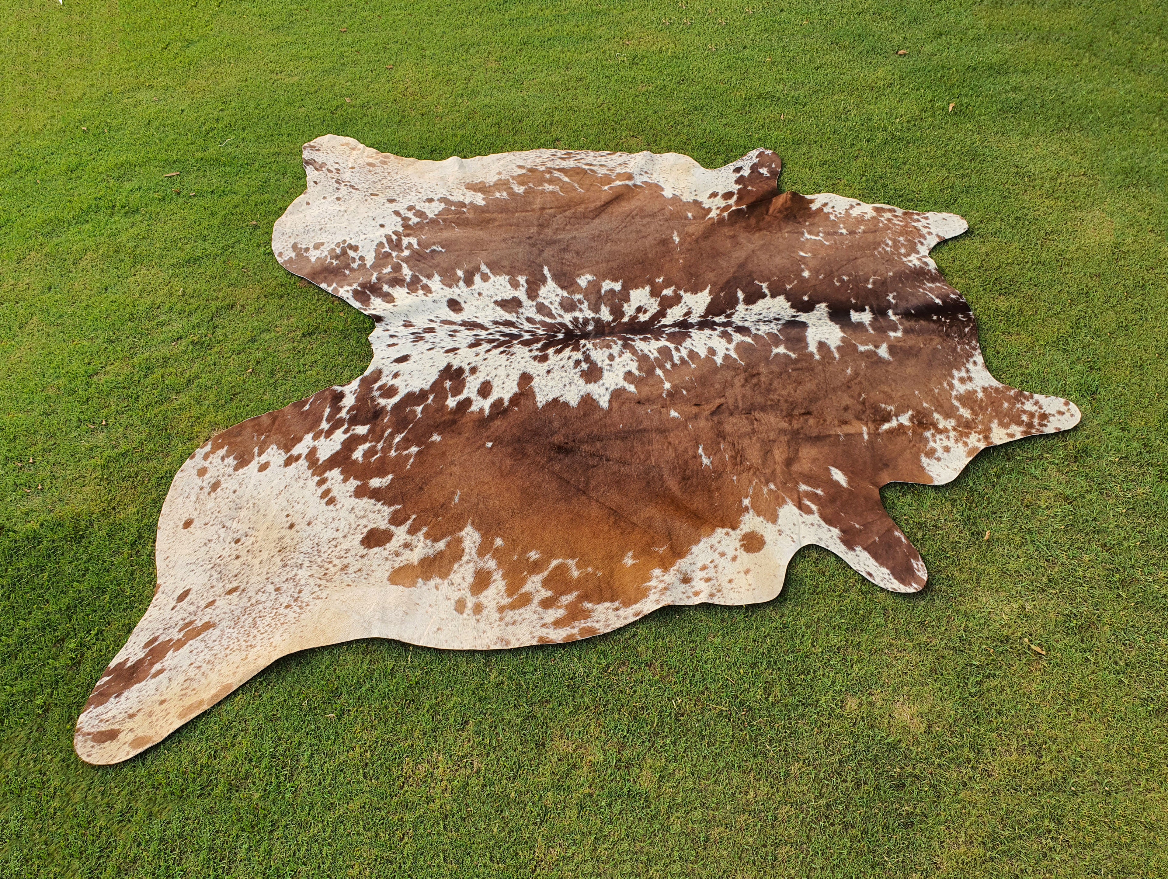 Reddish Brown and White Speckled Hair-On Cowhide Rug