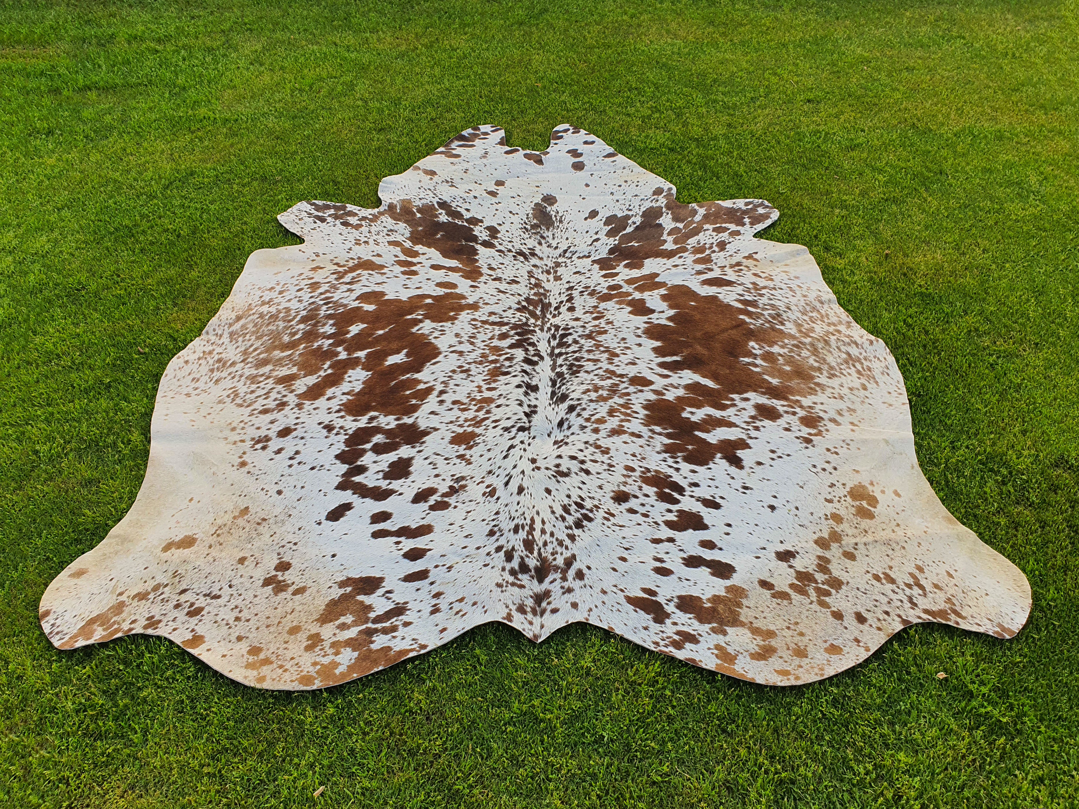 Tan Brown and White Cowhide Rug with Salt and Pepper Print