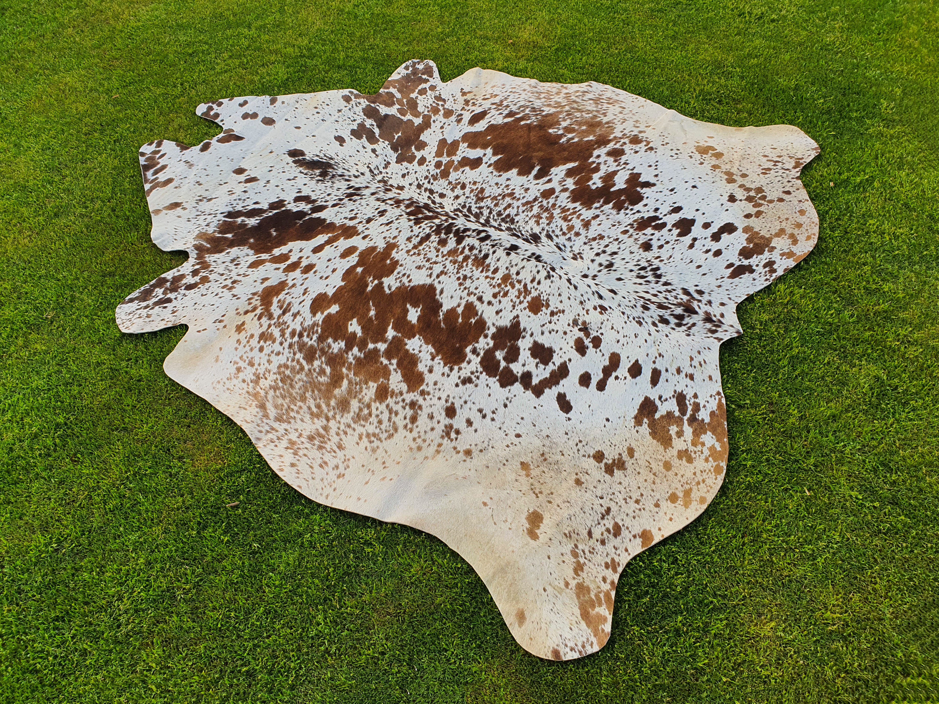 Tan Brown and White Cowhide Rug with Salt and Pepper Print