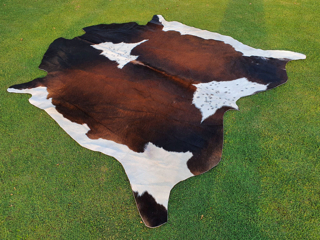 Chocolate Brown and White Tricolor Panda Print Cowhide Rug