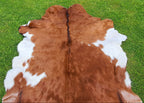 Brown and White Tricolor Goatskin Rug