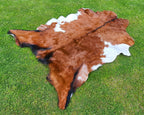 Brown and White Tricolor Goatskin Rug