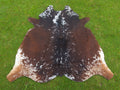 Reddish Brown and White Tricolor Cowhide Rug