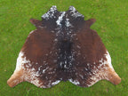 Reddish Brown and White Tricolor Cowhide Rug