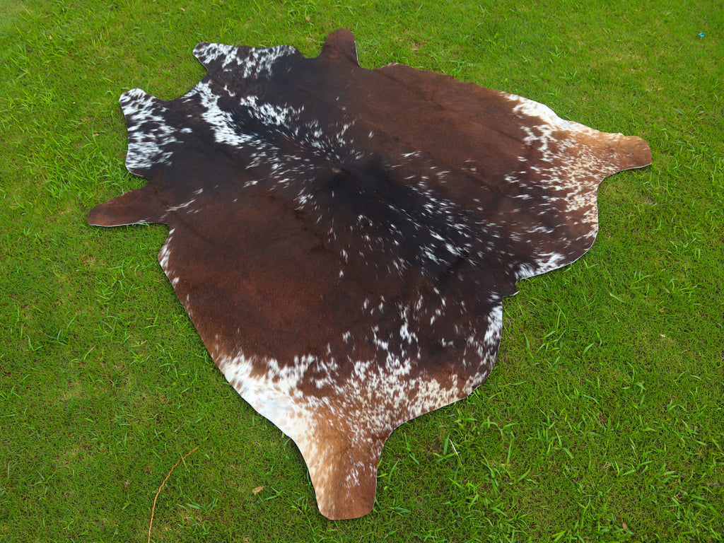 Reddish Brown and White Tricolor Cowhide Rug