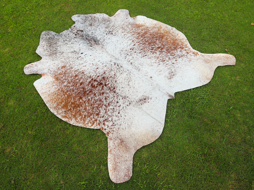Brown and White Cowhide Rug with Salt and Pepper Print