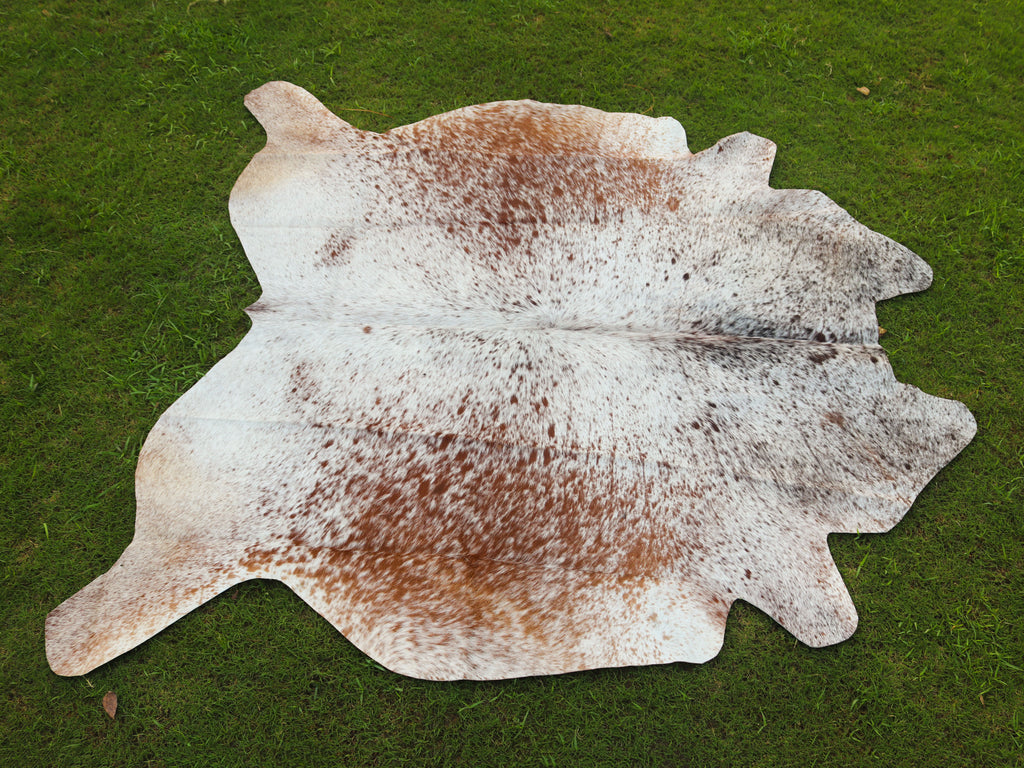 Brown and White Cowhide Rug with Salt and Pepper Print