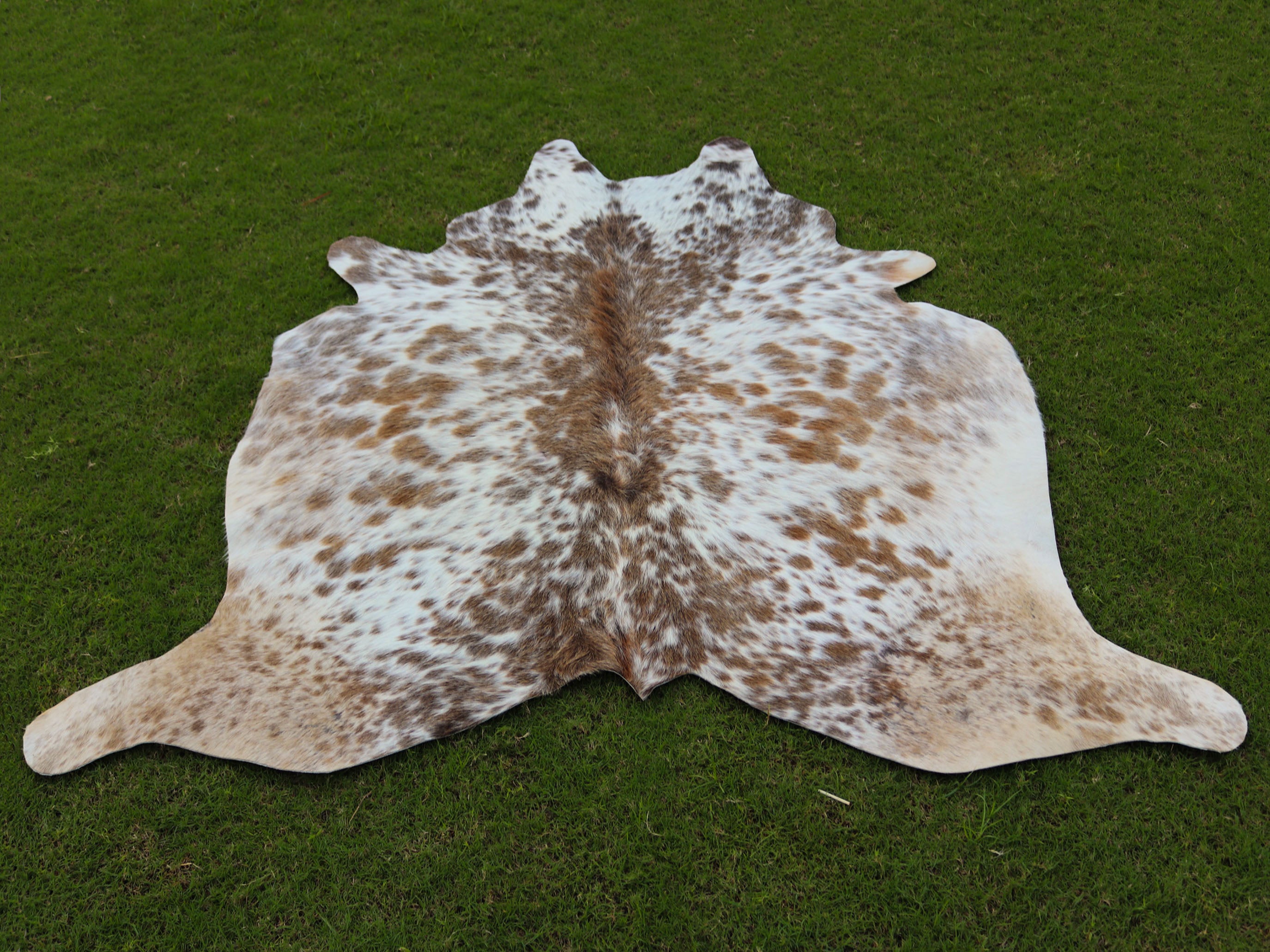 Beige and White Speckled Cowhide Rug