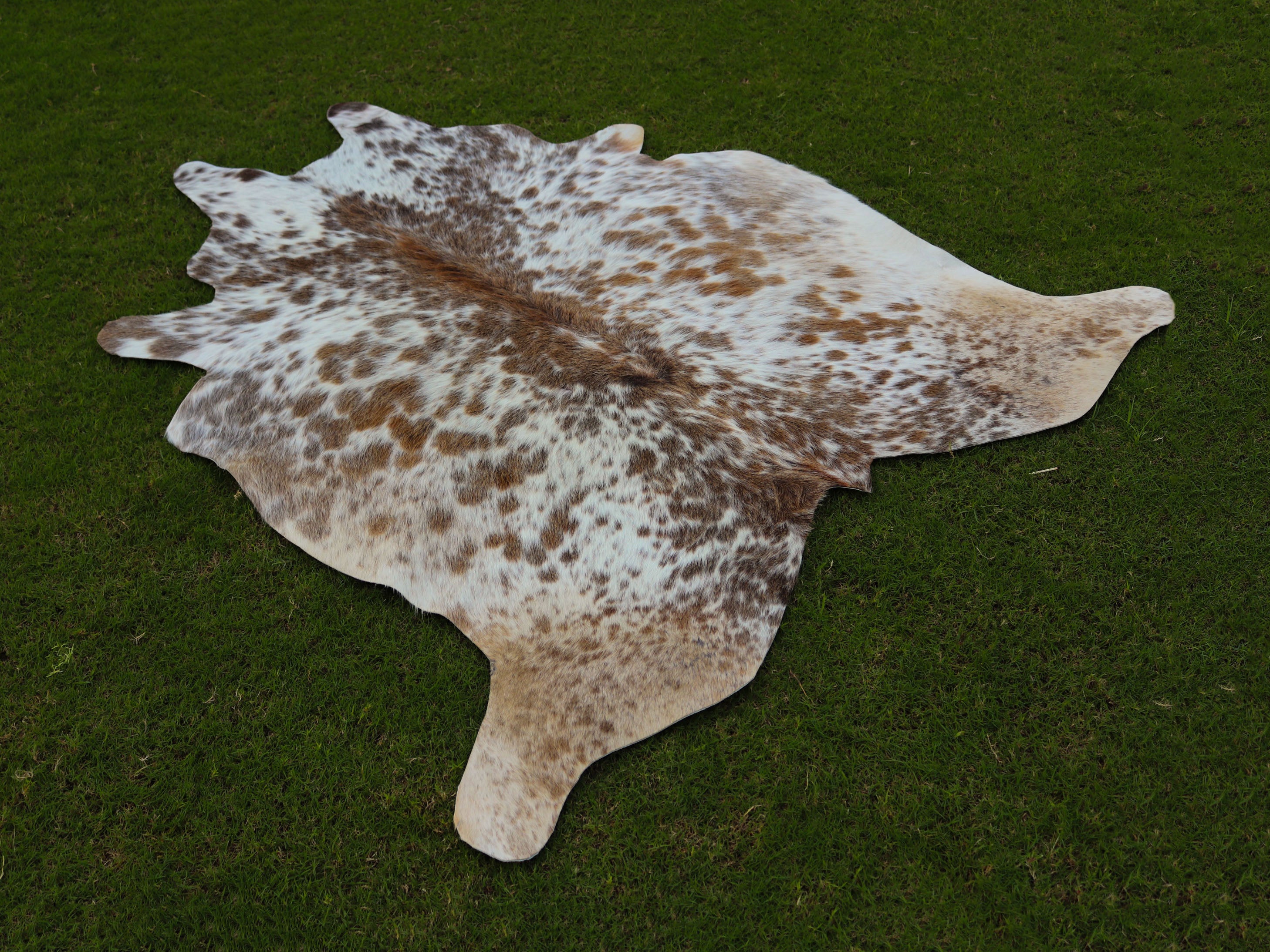 Beige and White Speckled Cowhide Rug