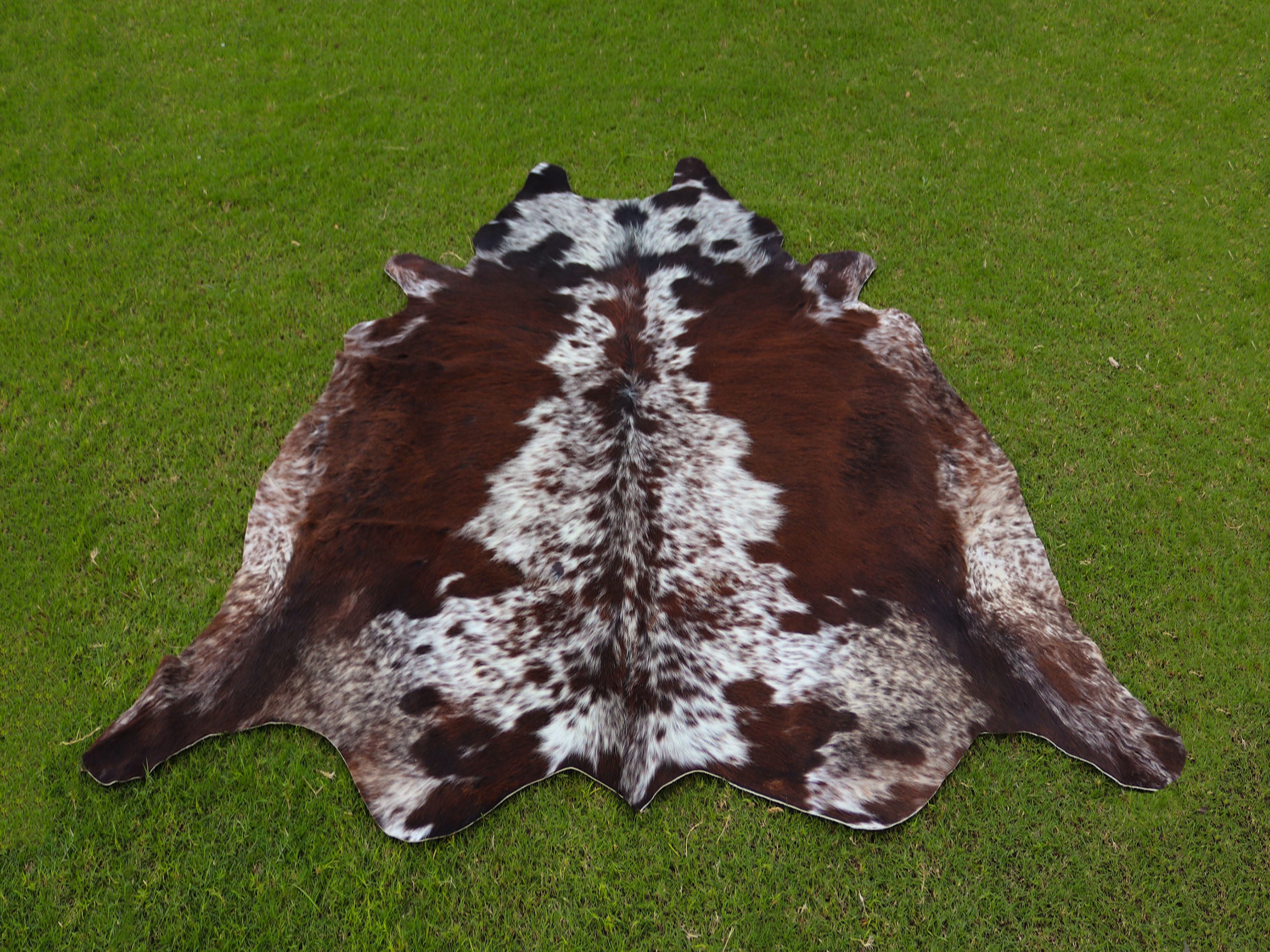 Tricolor Reddish Brown and White Brindle Cowhide Rug