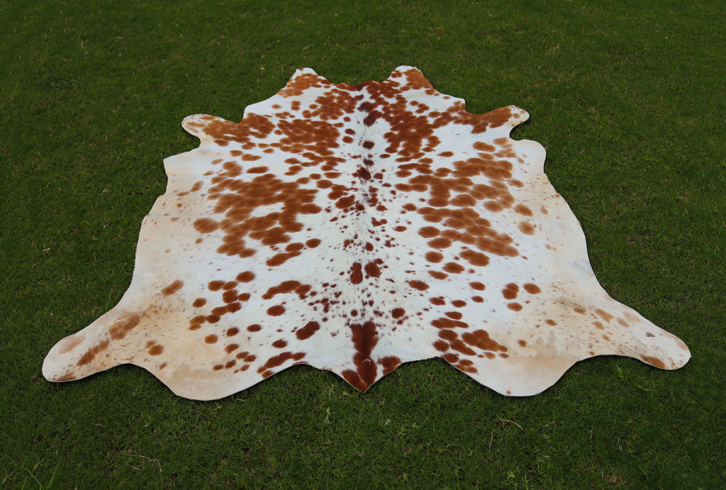 Brown and White Spotted Cowhide Rug for Home Decor