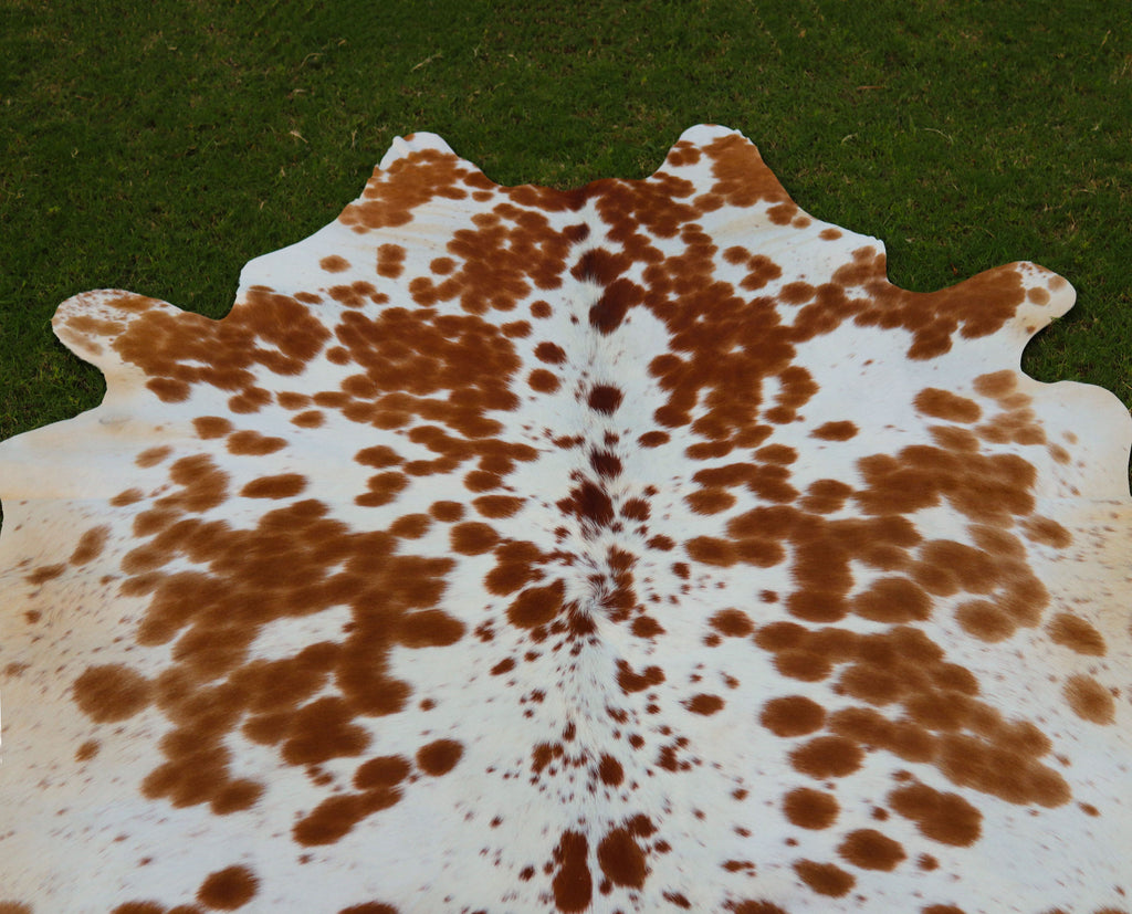 Brown and White Spotted Cowhide Rug for Home Decor