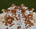 Brown and White Spotted Cowhide Rug for Home Decor