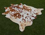 Brown and White Spotted Cowhide Rug for Home Decor