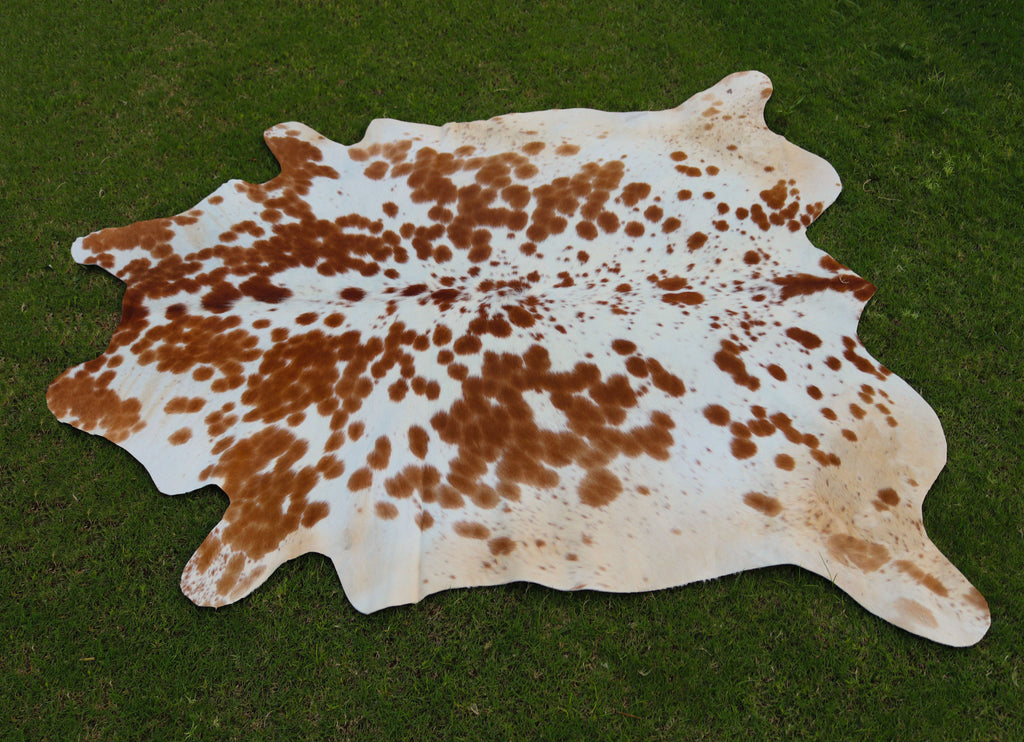 Brown and White Spotted Cowhide Rug for Home Decor