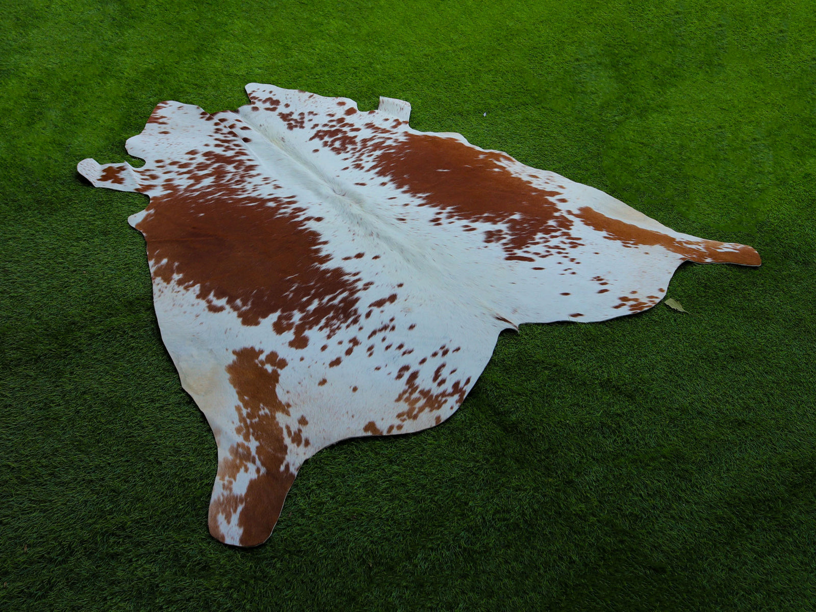Tan Brown and White Exclusive Cowhide Rug