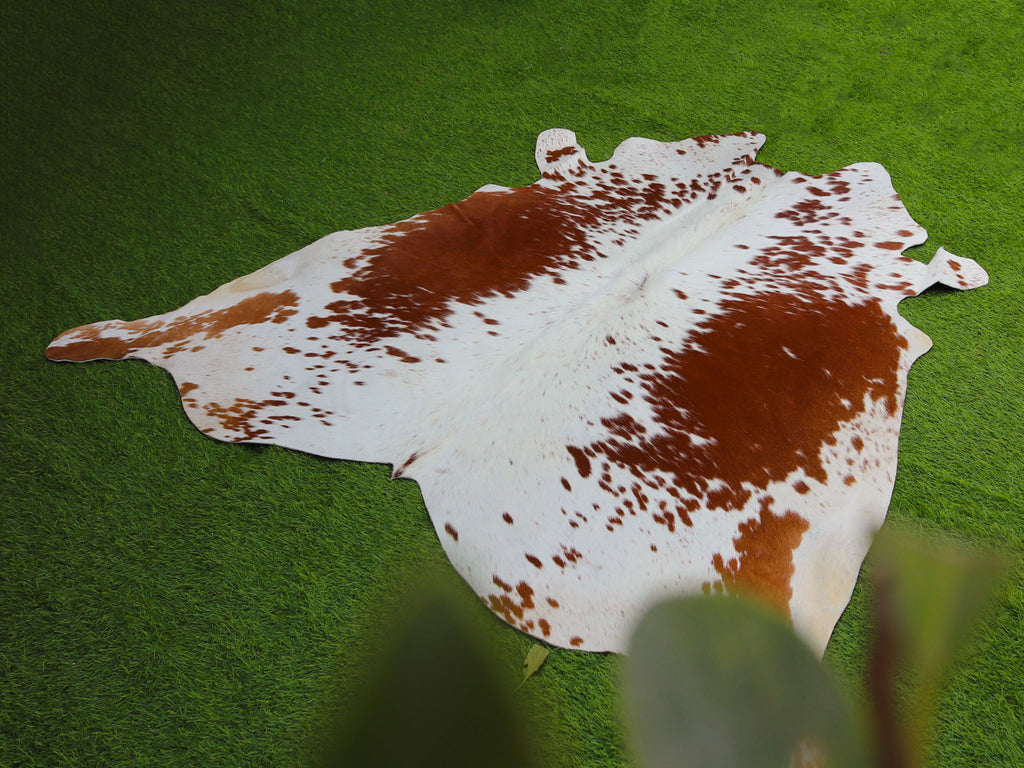 Tan Brown and White Exclusive Cowhide Rug