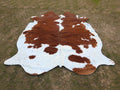 Brown and White Cowhide Rug in Panda Print Style
