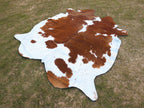 Brown and White Cowhide Rug in Panda Print Style