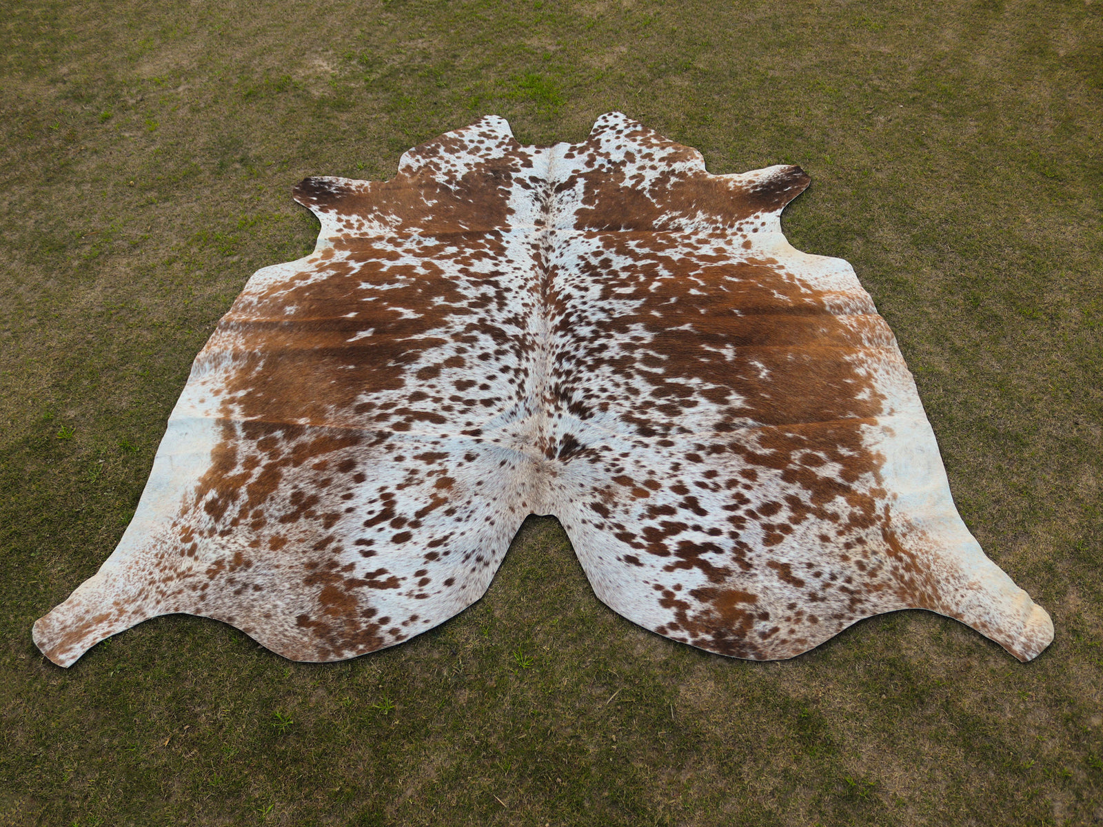 Tan Brown and White Speckled Cowhide Rug