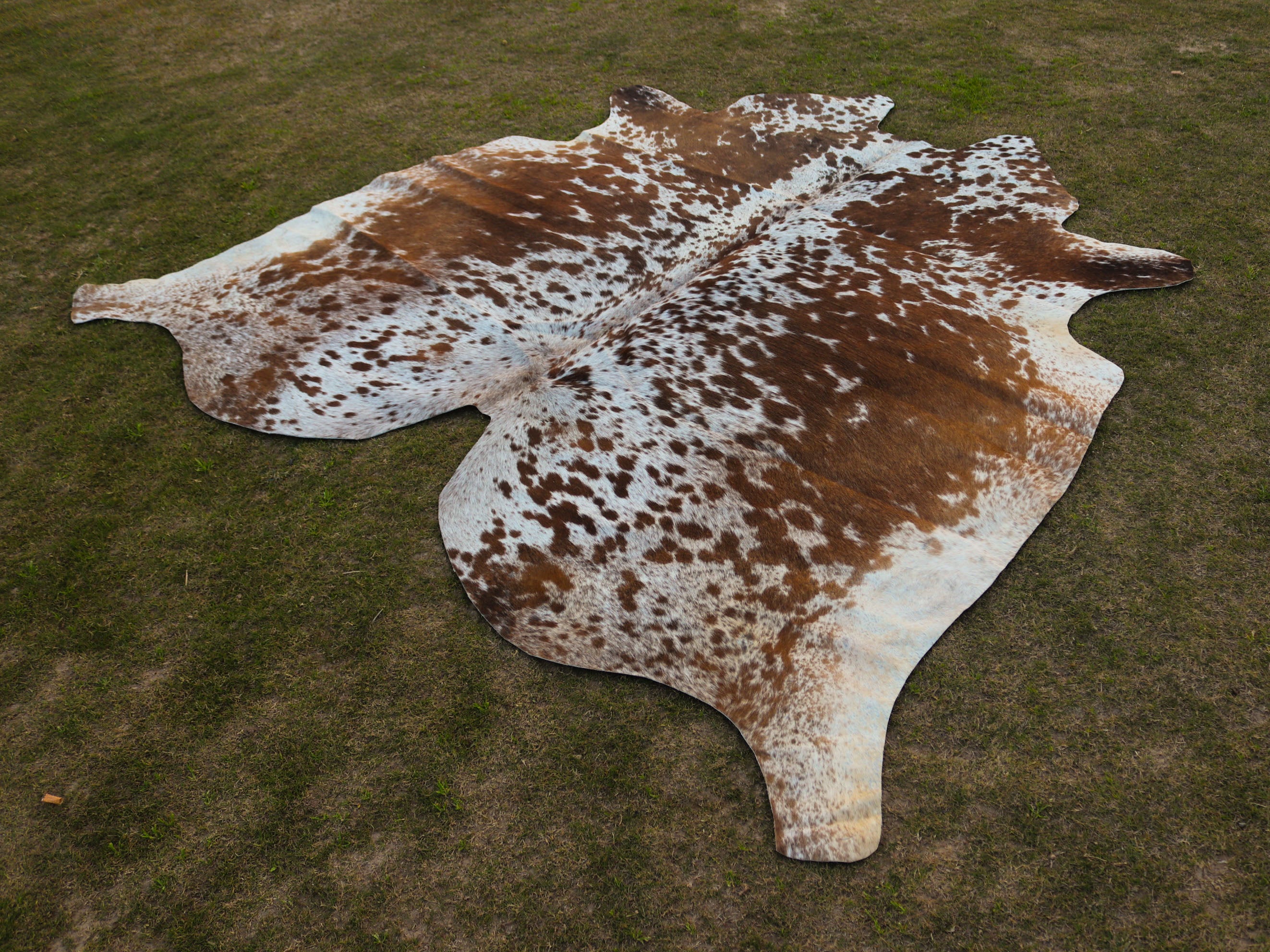 Tan Brown and White Speckled Cowhide Rug
