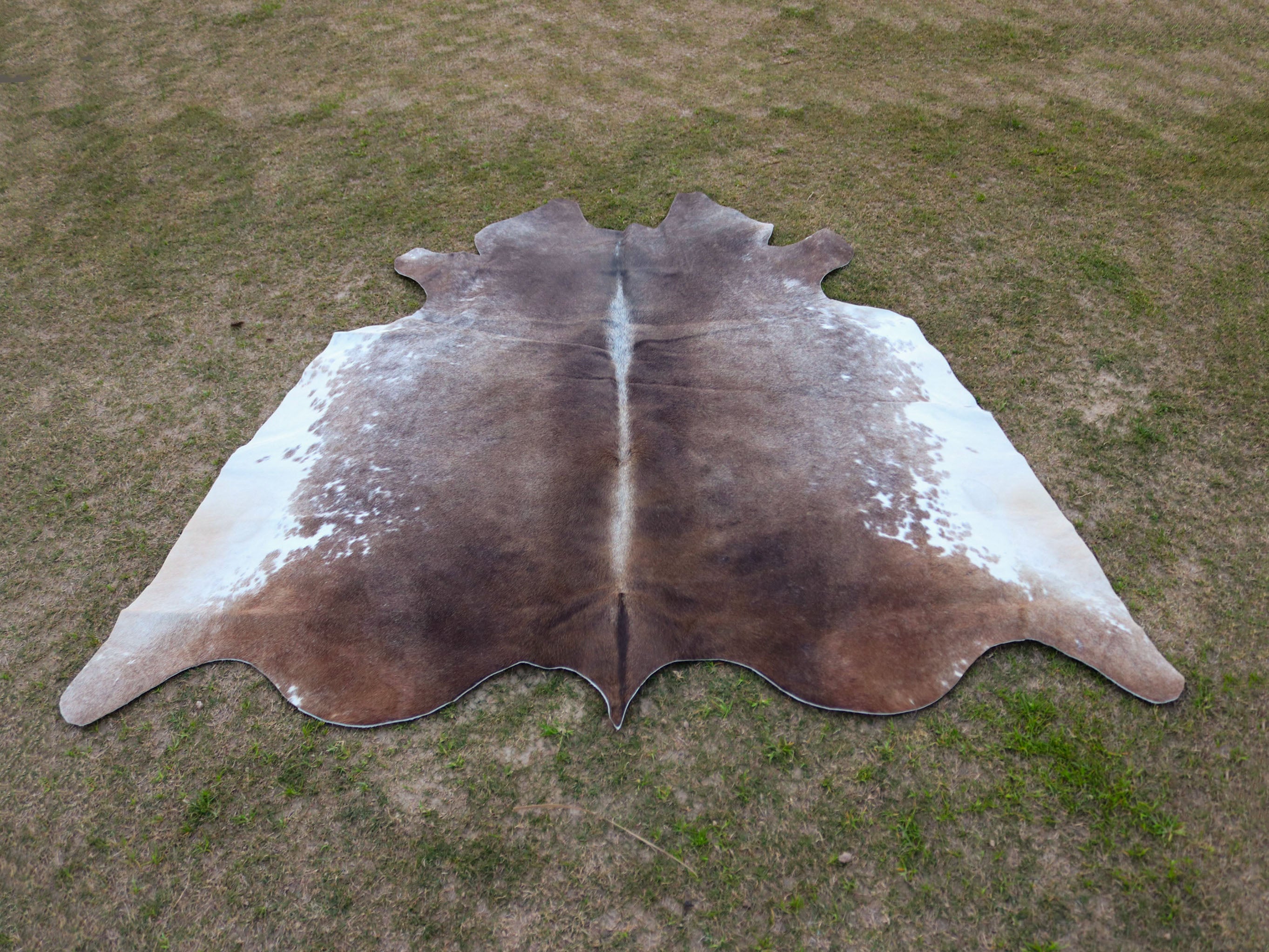 Greyish Beige and White Hereford Cowhide Rug
