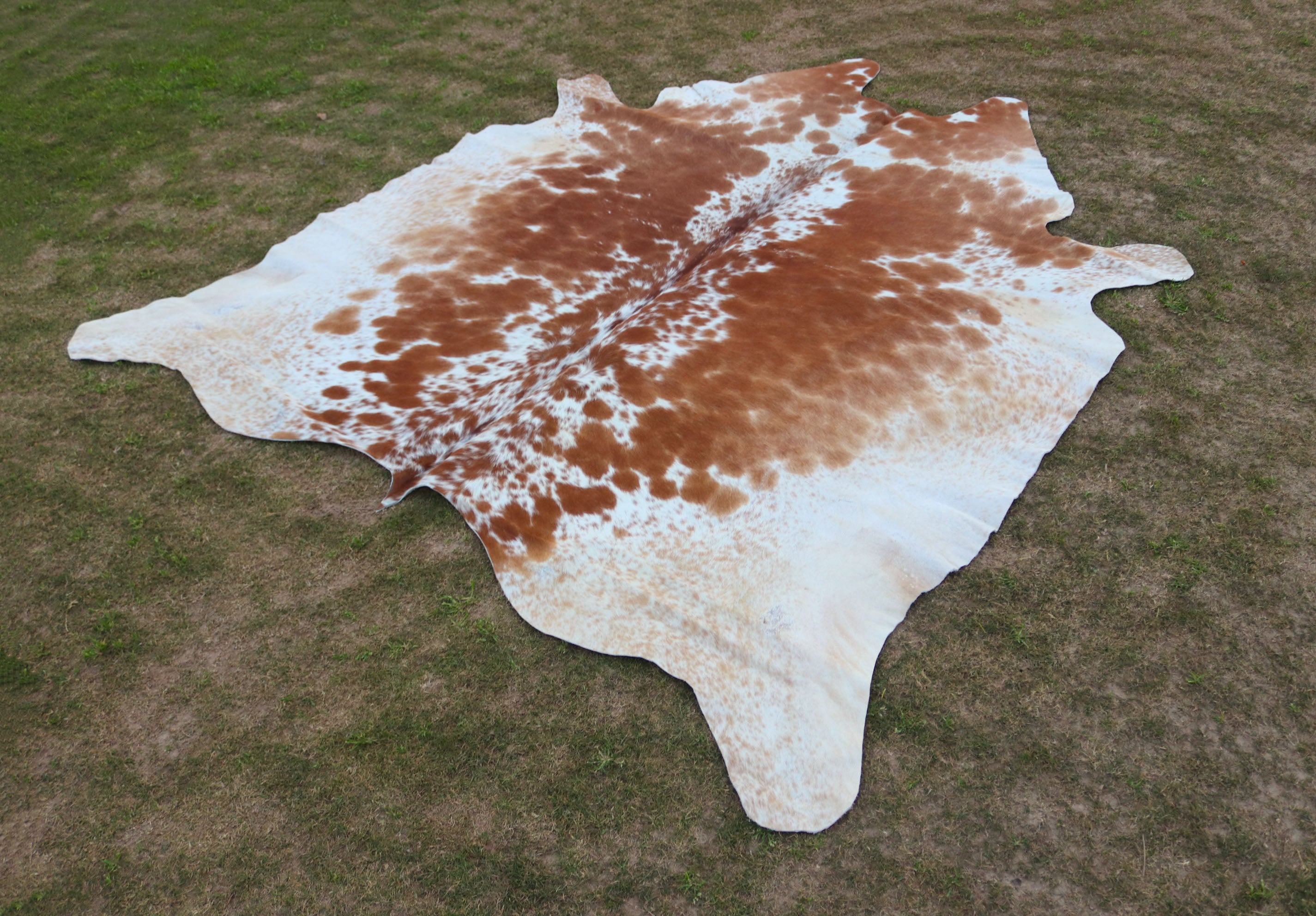 Tan Brown and White Speckled Cowhide Rug