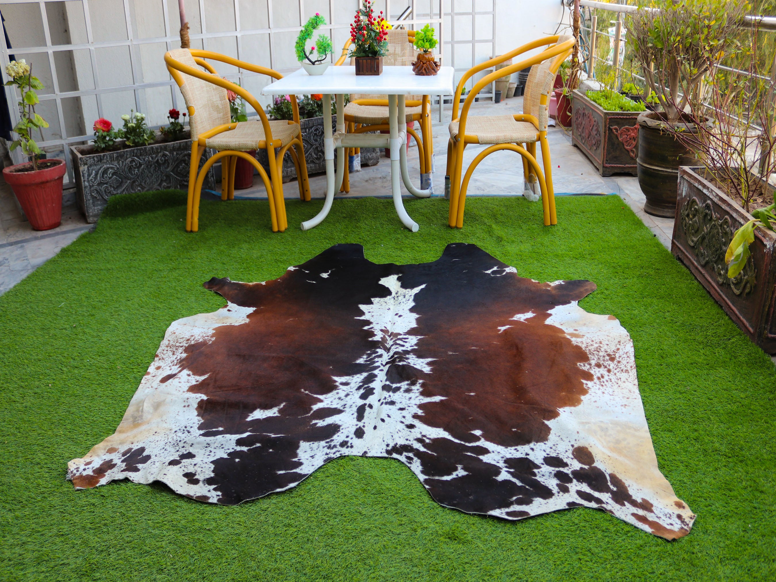 Tricolor Reddish Brown and White Cowhide Rug