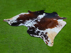 Tricolor Reddish Brown and White Cowhide Rug