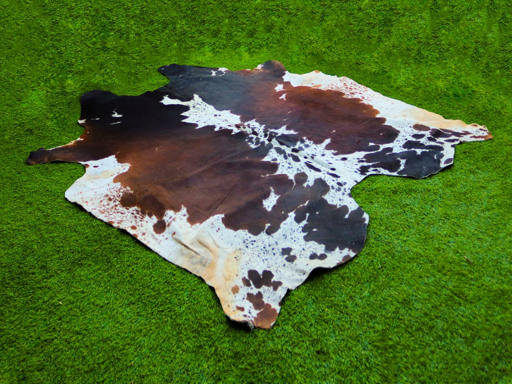 Tricolor Reddish Brown and White Cowhide Rug