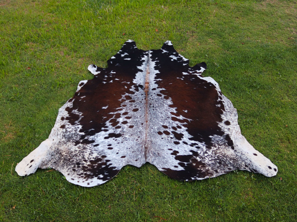 Reddish Brown and White Tricolor Speckled Cowhide Rug