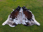 Reddish Brown and White Tricolor Speckled Cowhide Rug