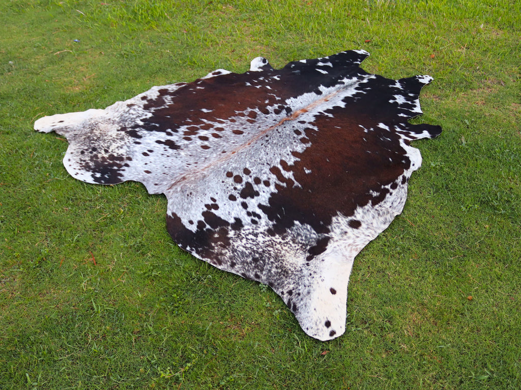 Reddish Brown and White Tricolor Speckled Cowhide Rug