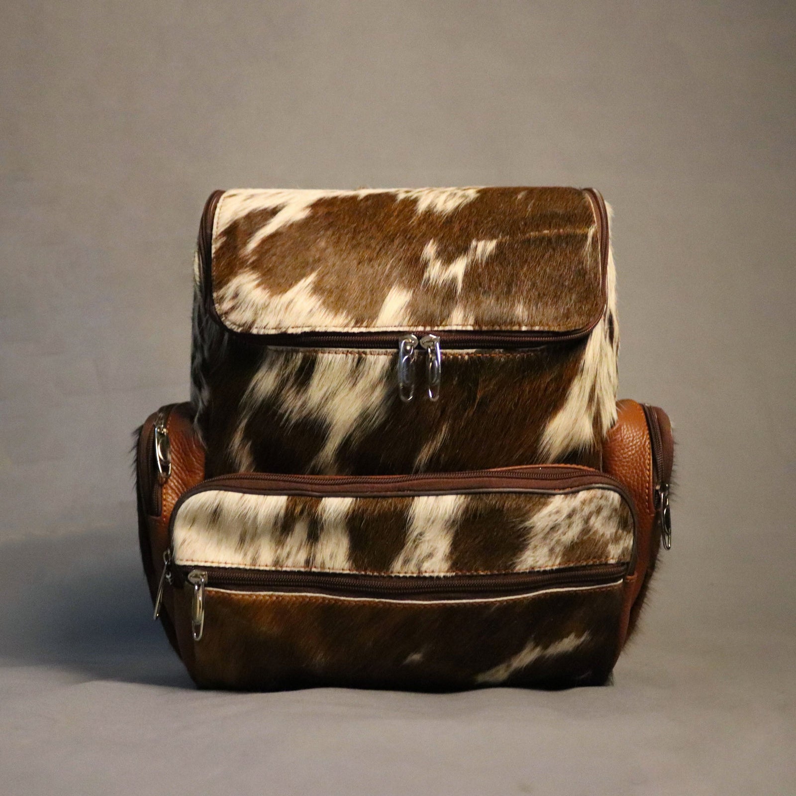 Cowhide Backpack Bag - Brown and White